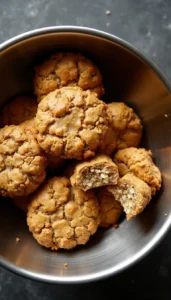 Homemade banana oatmeal dog treats with crispy golden exterior and tender center